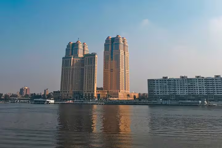 Cairo Nile River skyline at sunset, ideal for a Nile dinner cruise after Giza Pyramids and museum tour