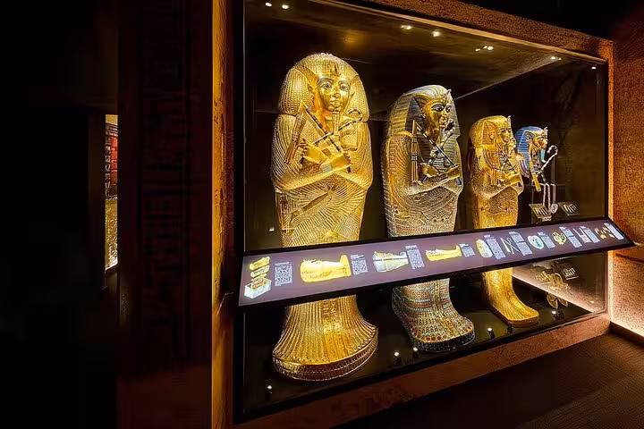 Golden pharaonic coffins display at Cairo museum, optional Tutankhamun mask visit on Cairo flight tour