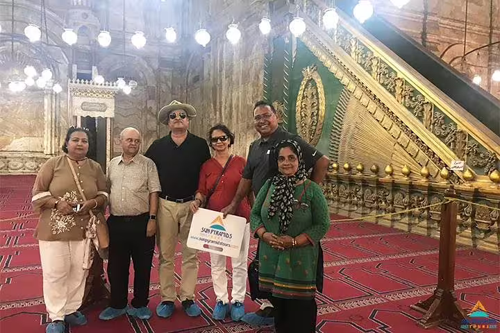 Tour group inside Cairo mosque on 4-day Cairo and Red Sea package, Islamic architecture and guided visit