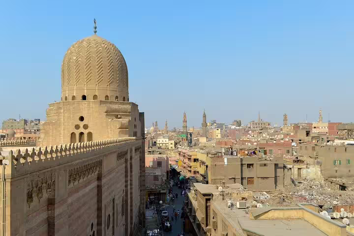 Panoramic view over historic Cairo from Al-Azhar Park, with mosque dome and skyline on dinner tour