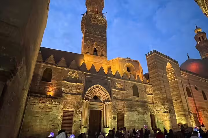Illuminated Al-Muizz Street mosque facade in Islamic Cairo on day trip from Alexandria with Port Said return