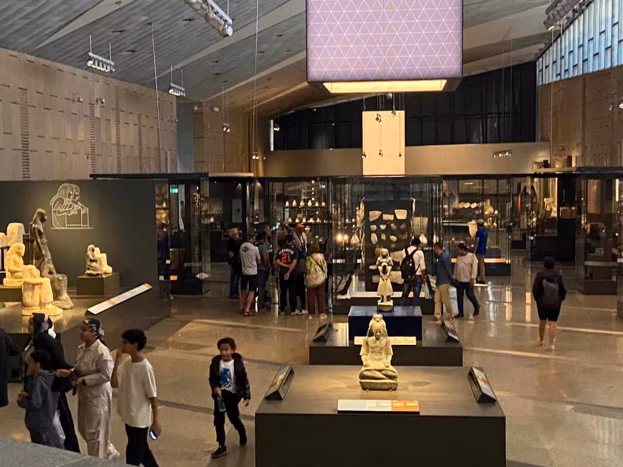 Grand Egyptian Museum gallery in Cairo with ancient statues, ideal 4-day Cairo tour package with hotel