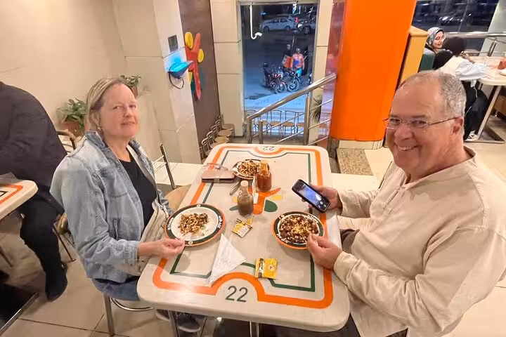 Tourists dining in a Cairo restaurant, local food experience included in 4 days Cairo tour package with accommodation