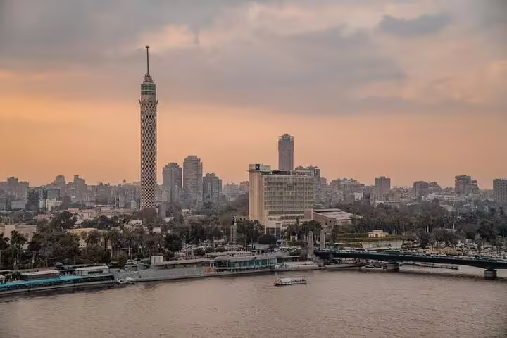 Cairo Tower skyline view over the Nile at sunset, a highlight of the Giza Pyramids and Cairo city tour