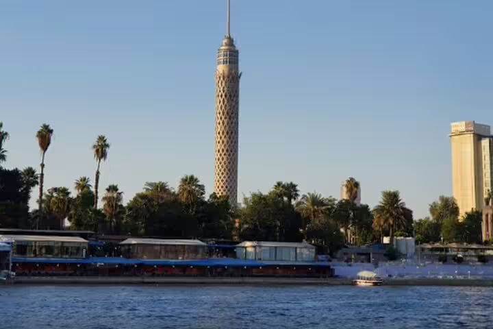 Cairo Tower on the Nile River at sunset, scenic stop on Giza Pyramids, museum visit and dinner cruise combo