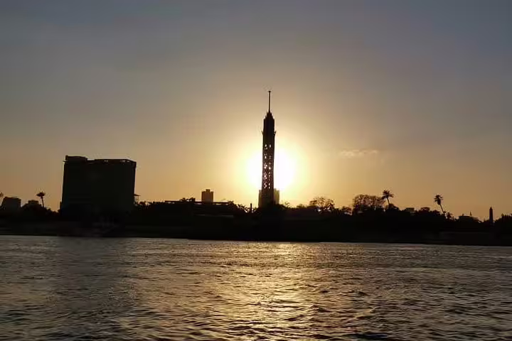 Cairo Tower sunset over the Nile River, iconic skyline view on Giza Pyramids and Old Cairo day tour