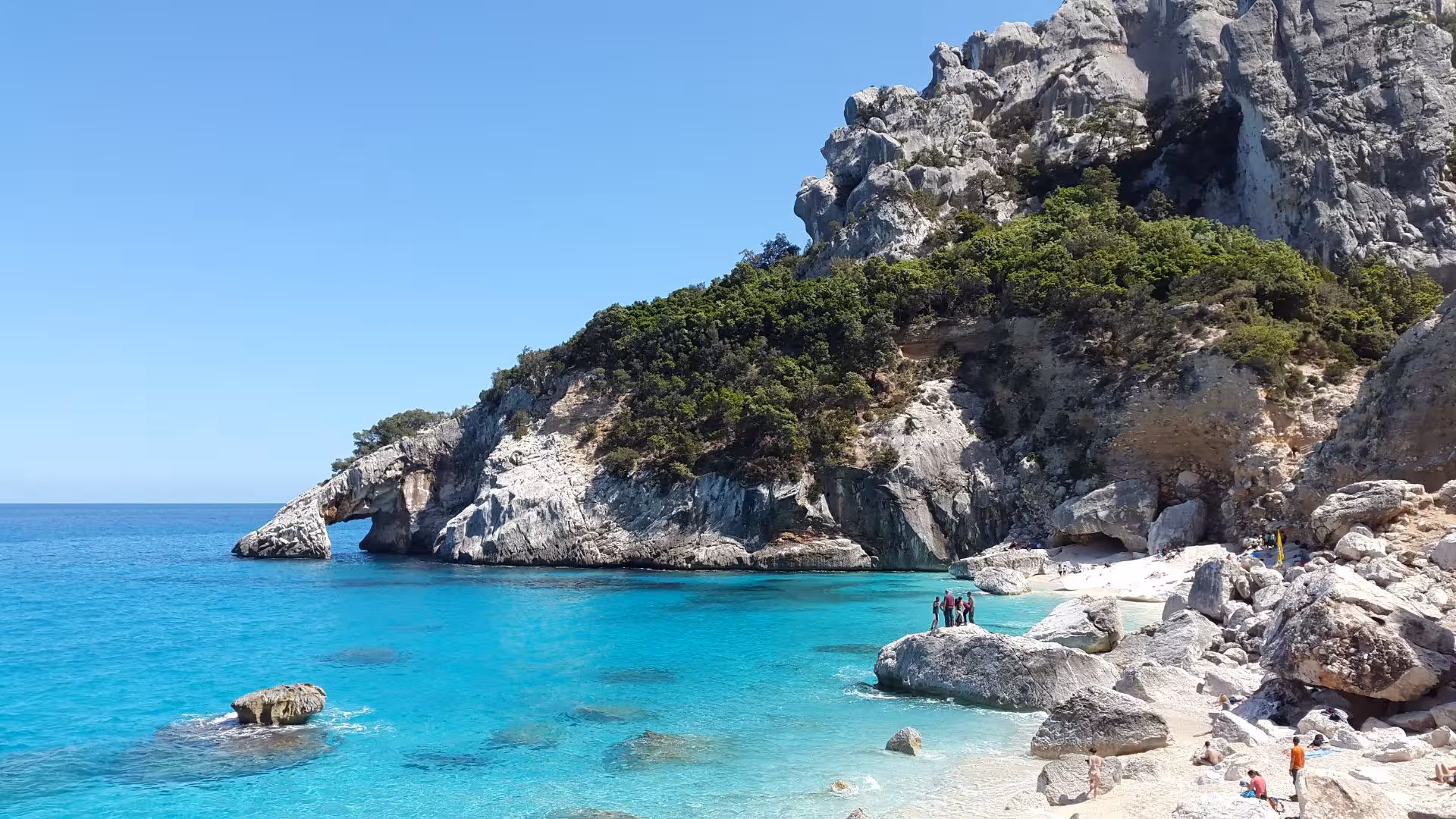 Breathtaking view of Cala Goloritzè's crystal-clear waters and dramatic cliffs, a highlight of the RIB tour.