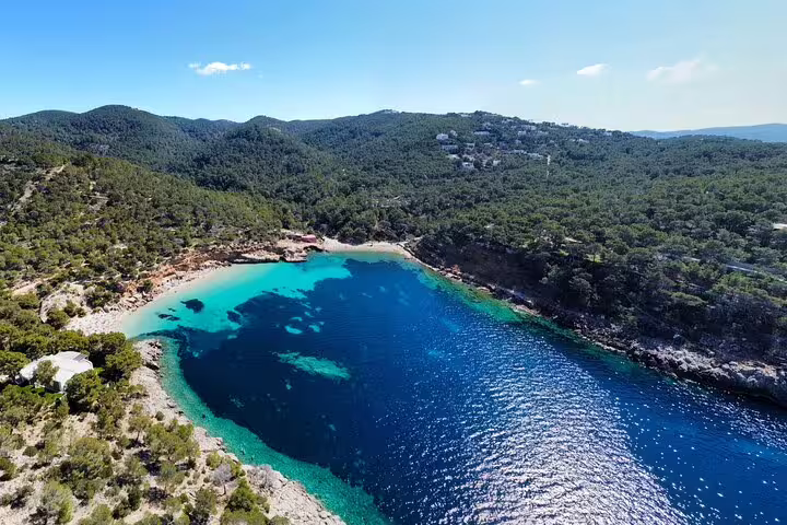 Aerial view of Cala Salada Ibiza bay with turquoise water, ideal stop on guided jet ski tour
