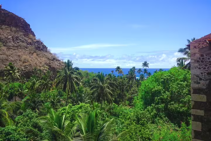 Lush Calabaceira Valley on Santiago Island with palm trees and Atlantic views on a guided hike to Cidade Velha