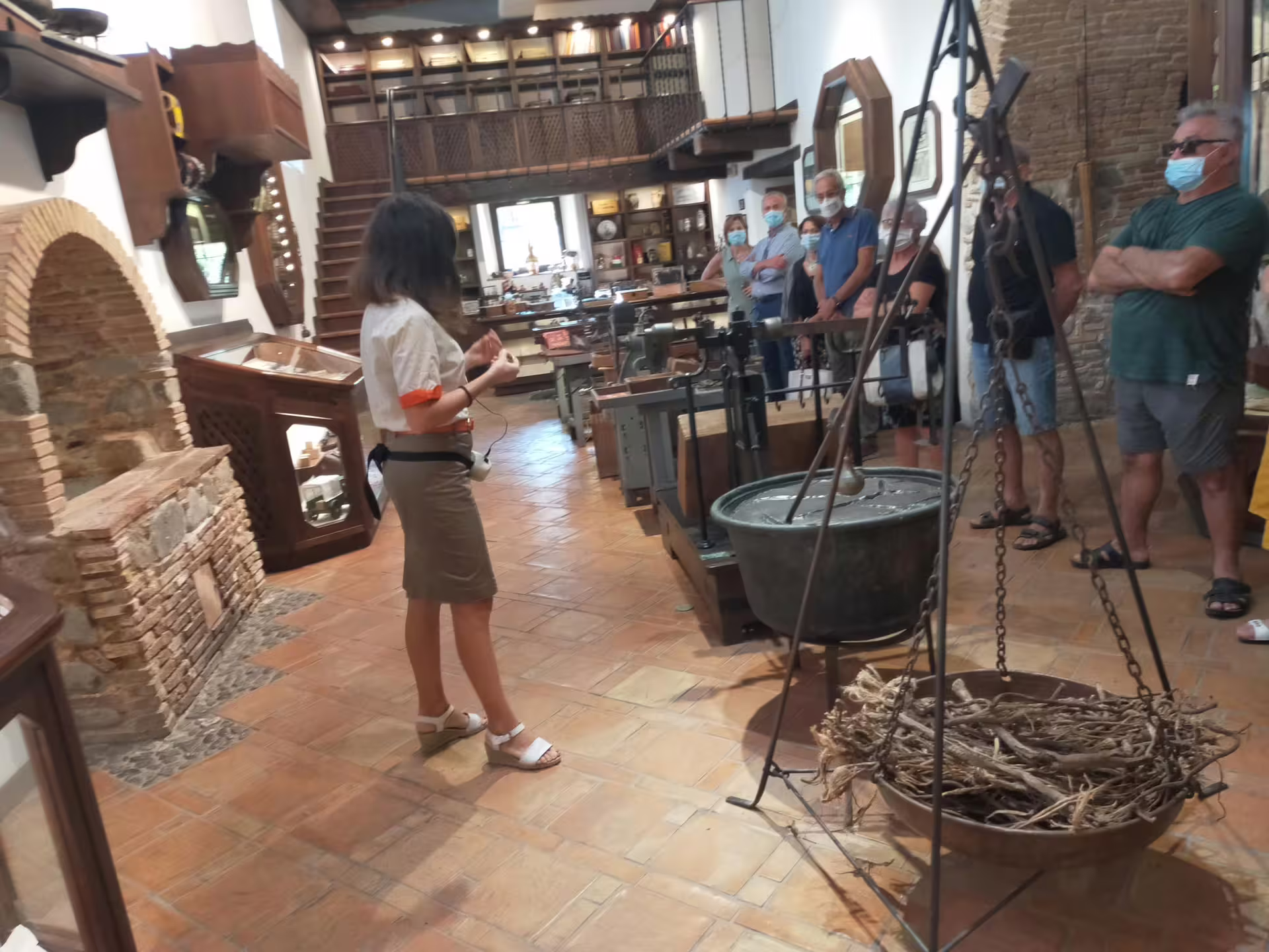 Guided tour inside a traditional Calabrian museum in Rossano, exploring historic olive oil tools and local Byzantine heritage