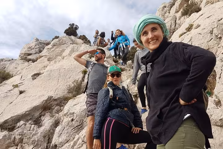 Hikers on rocky Calanques trail near Marseille, guided small-group trek on a 3-day Calanques tour