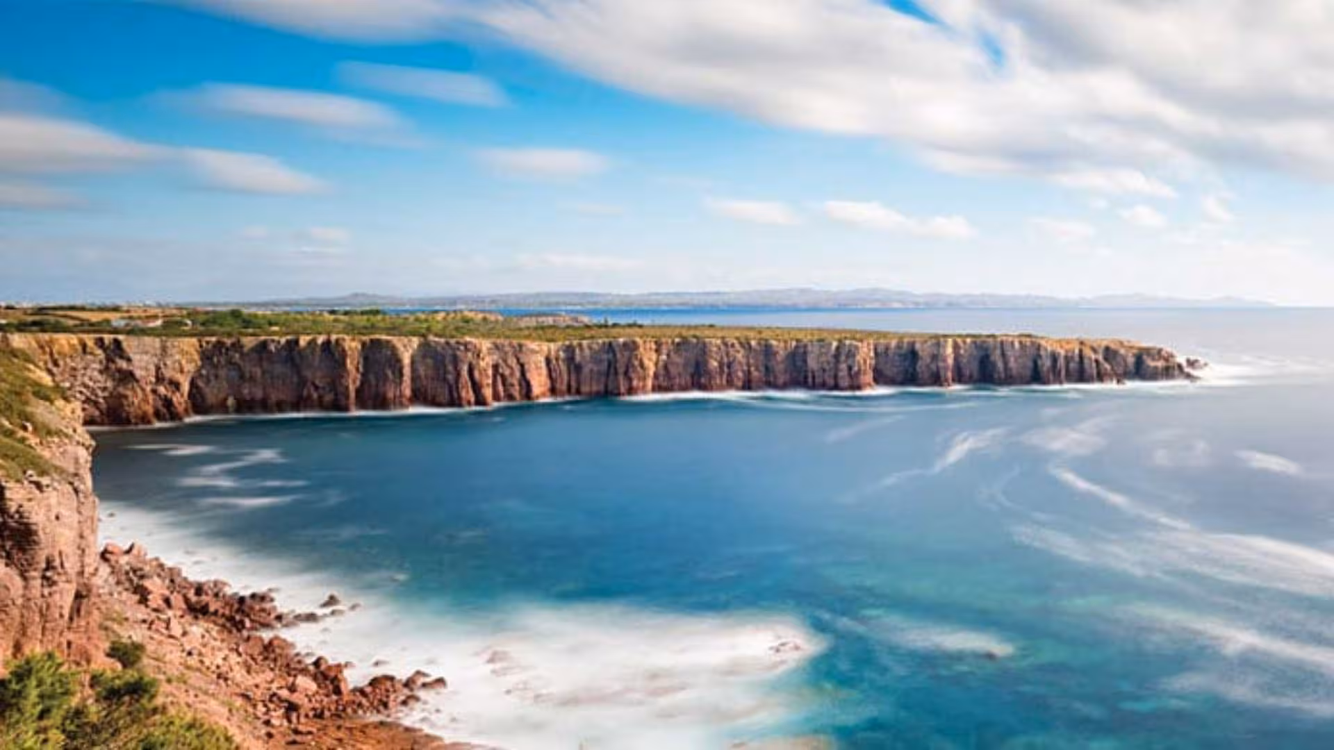 Breathtaking Calasetta cliff view with expansive ocean, perfect for RIB hire adventures and scenic tours.