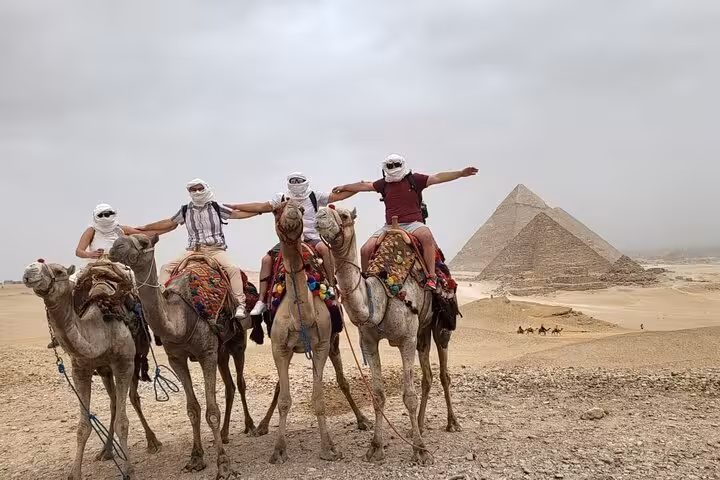 Camel ride tour at Giza Pyramids, Cairo day trip flight package with optional Tutankhamun mask visit