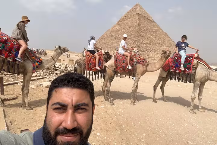 Camel ride at the Giza Pyramids with guide selfie, a highlight of private Sphinx and GEM tour Cairo