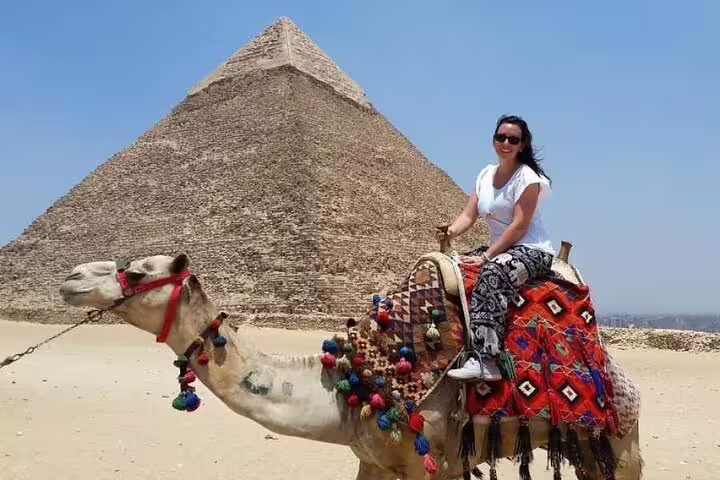 Camel ride by the Great Pyramid of Giza on a private Cairo tour, part of 4-day Cairo and Bahariya adventure