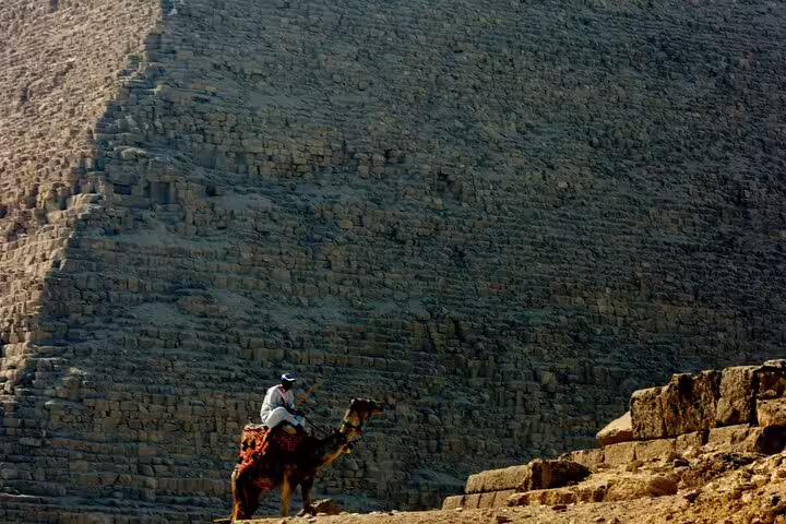 Camel rider beside the Great Pyramid of Giza, highlight of 2 day Cairo by air tour from Hurghada