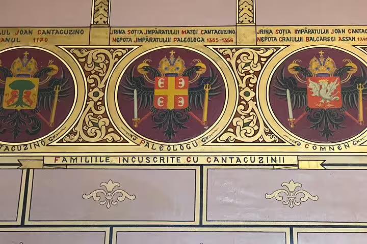 Cantacuzino Castle heraldic coat of arms fresco showing noble family crests and Latin inscriptions