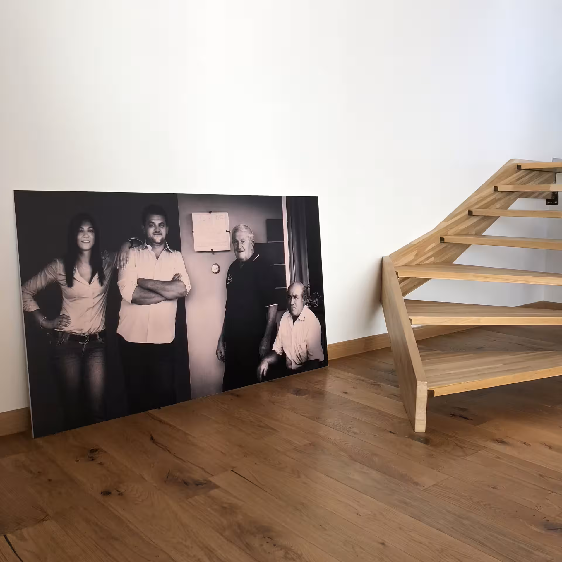 Cantine Mucci winery interior with family photo beside wooden stairs, part of vineyard visit and wine tasting tour