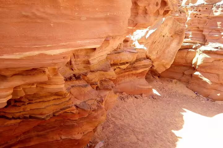 Sunlit sandstone formations inside Canyon Salama, a highlight of the Jeep safari tour from Sharm el Sheikh