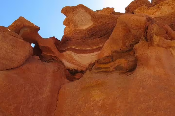 Wind-carved sandstone cliffs in Canyon Salama on a Jeep safari tour from Sharm el Sheikh to Dahab