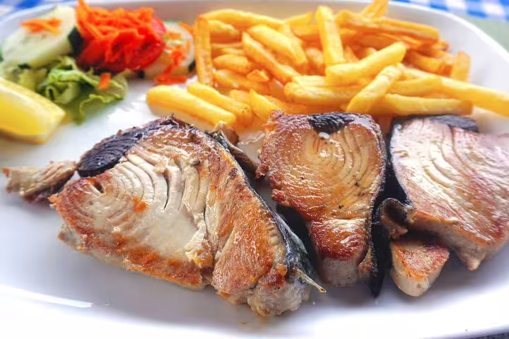 Cape Verde grilled fish with fries and salad, a tasty lunch stop on the Calabaceira Valley hike to Cidade Velha