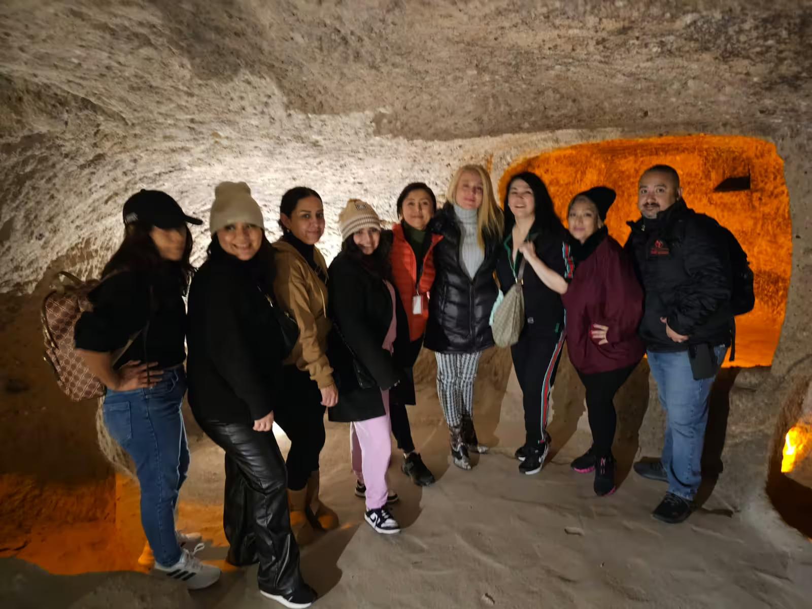 Tour group inside Cappadocia cave on full-day Cappadocia from Istanbul by flight guided excursion