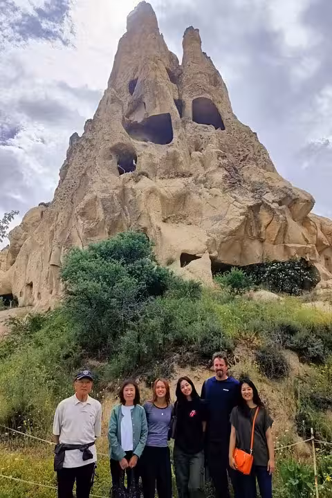 Group photo at Cappadocia fairy chimneys on private tour with English guide and luxury vehicle