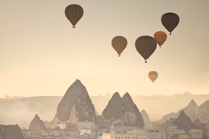 Cappadocia sunrise hot air balloons over Göreme fairy chimneys on a private all-inclusive 2-day guided tour