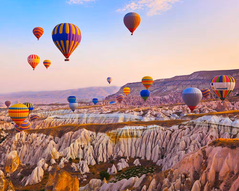 Cappadocia hot air balloons over fairy chimneys at sunrise, highlight of 5 Days Taste of Turkey tour