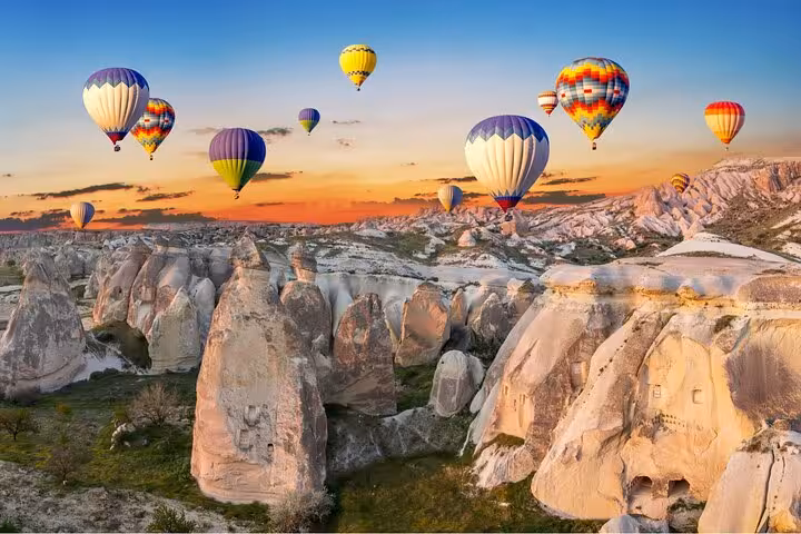 Cappadocia hot air balloons over fairy chimneys at sunrise, a must-see on a 10-day Turkey highlights tour