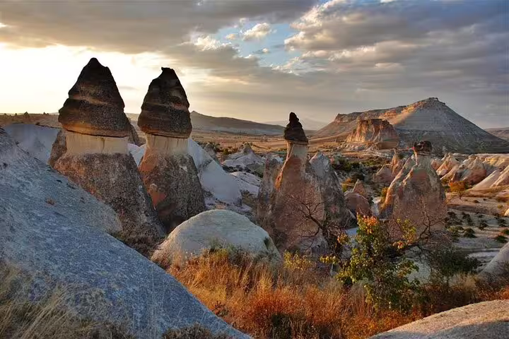 Explore Cappadocia's iconic fairy chimneys at sunset on a private tour from HOTEL & ASR-NAV Airport.