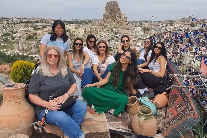 Group photo at Cappadocia panoramic viewpoint over Göreme, ideal stop on a private day tour with guide and vehicle