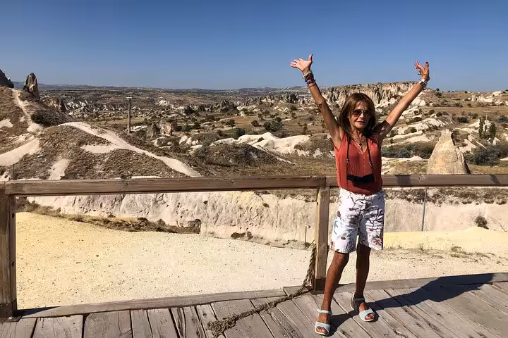 Traveler at Cappadocia panoramic viewpoint on private tour with English guide and luxury vehicle