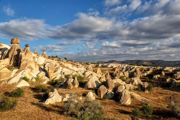 Breathtaking view of Cappadocia's unique rock formations under a clear blue sky on private guided tour.