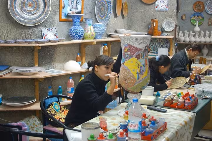 Cappadocia shopping tour in Avanos, artisans hand-painting Turkish ceramics and Iznik-style plates