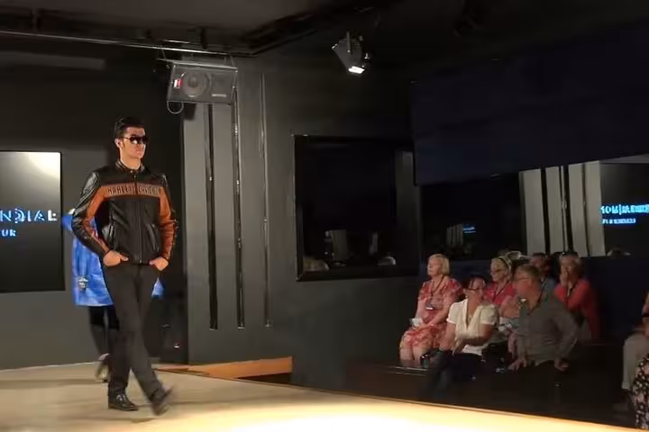 Fashion runway show in Cappadocia boutique, highlighting local designer clothing on guided shopping tour