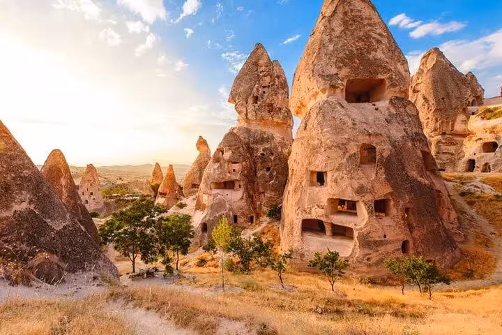 Cappadocia small group tour view of fairy chimneys and cave dwellings near Göreme at sunset