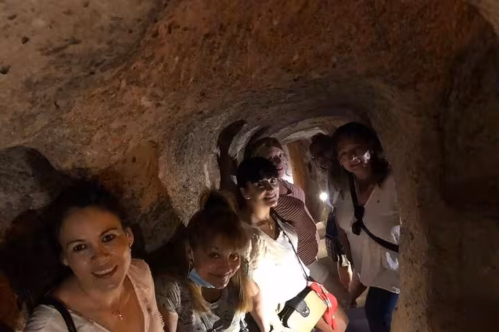 Small group explores Cappadocia underground city tunnel on 2-day North and South tour with guide