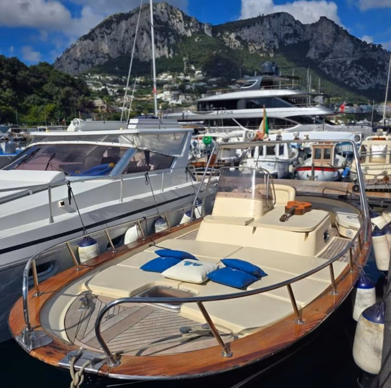 Private boat in Marina Grande, Capri, ready for a 6-hour tour to swim, relax and explore hidden gems