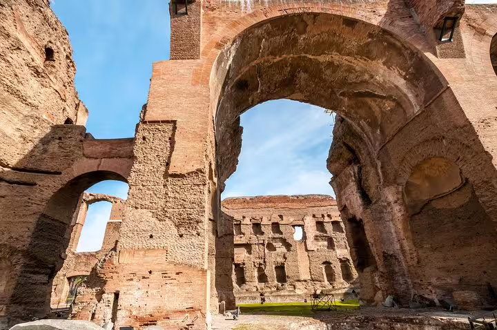 Massive brick arches and towering ruins of the Baths of Caracalla in Rome captured on an exclusive VIP guided tour