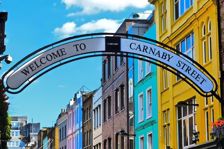 Carnaby Street welcome arch and colorful Soho buildings on a full-day London sightseeing tour with a local guide
