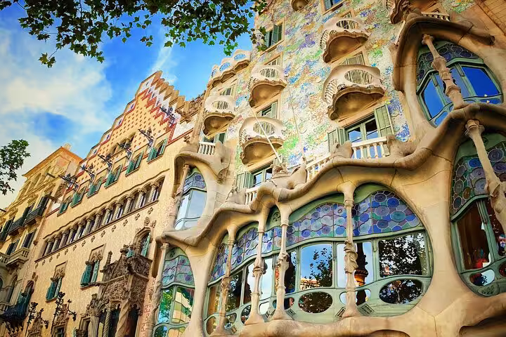 Explore the vibrant facade of Casa Batlló, a stunning example of Gaudi architecture on the Barcelona walking tour.