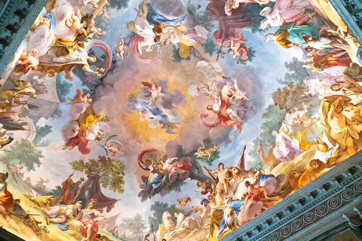 Baroque frescoed ceiling of Caserta Royal Palace seen on private guided tour, showcasing vivid mythological scenes and ornate details