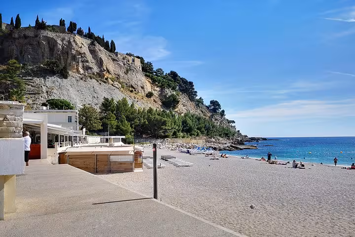 Cassis beach and turquoise Mediterranean by Cap Canaille cliffs, scenic stop on a full-day private Arles shore excursion