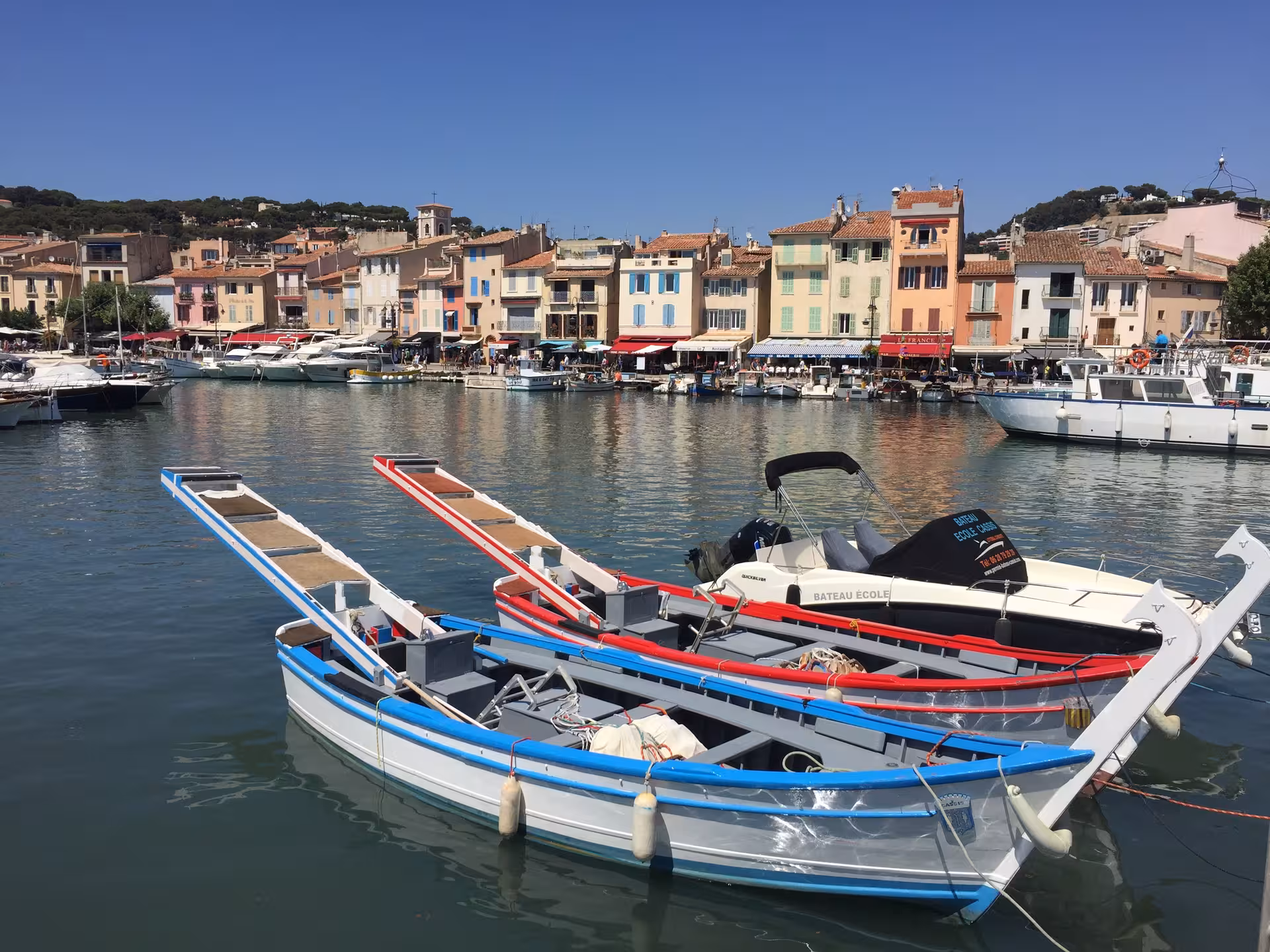 Colorful Cassis harbor with traditional boats, a key stop on the best of the Calanques 3-day trip