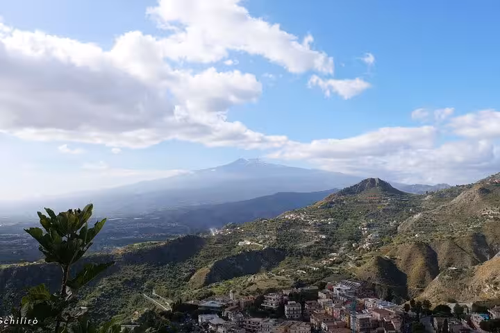 Experience breathtaking vistas of Mount Etna and lush valleys from Castelmola, a must-see on Sicilian tours.