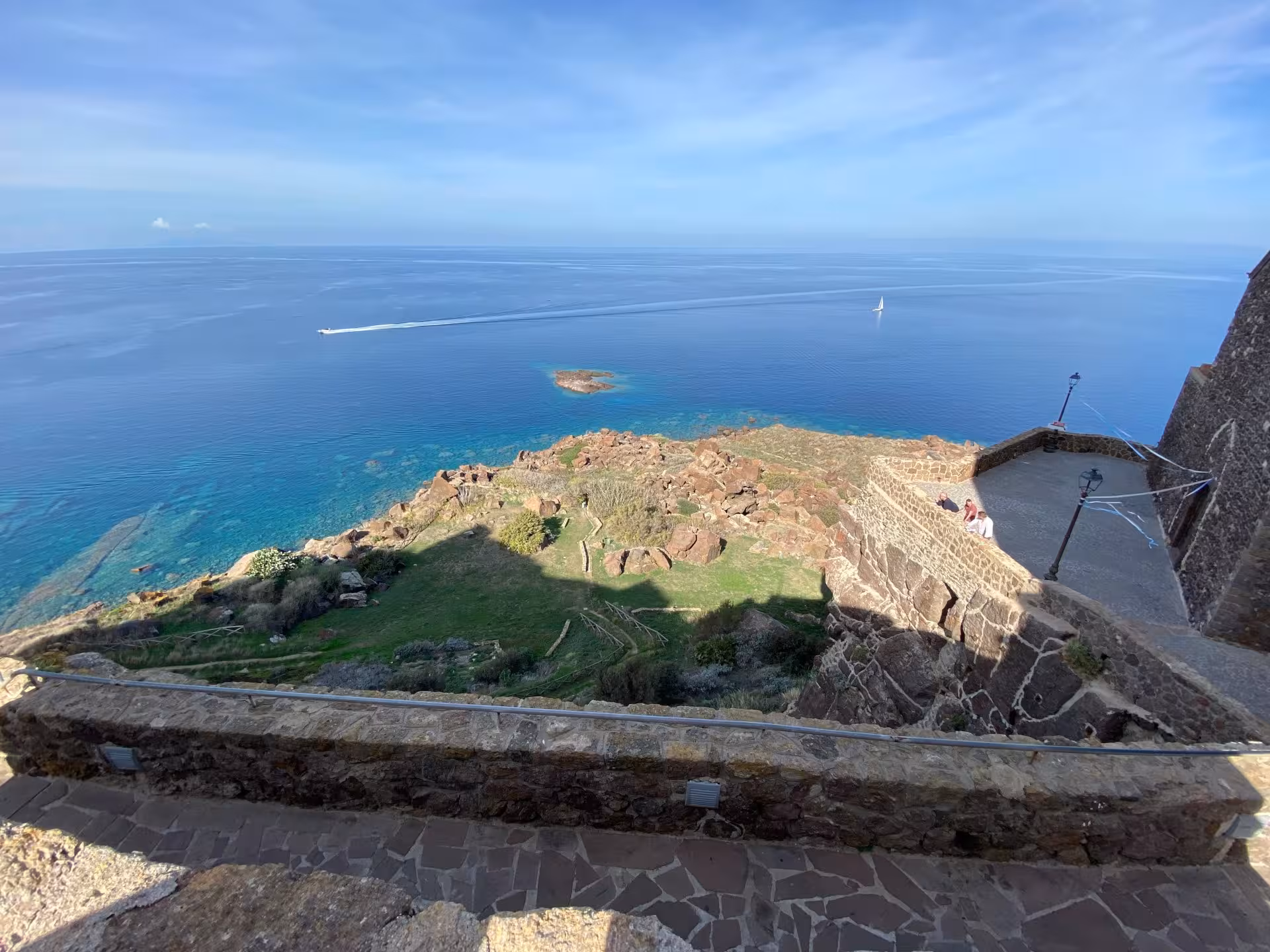 Stunning coastal view from Castelsardo showcasing rocky shoreline and expansive Mediterranean waters.