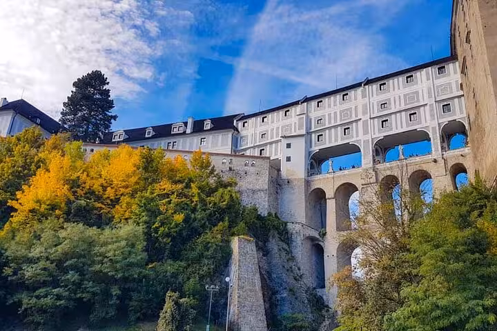 Cesky Krumlov Castle arches and hillside gardens in autumn on a private day trip from Salzburg to Czechia