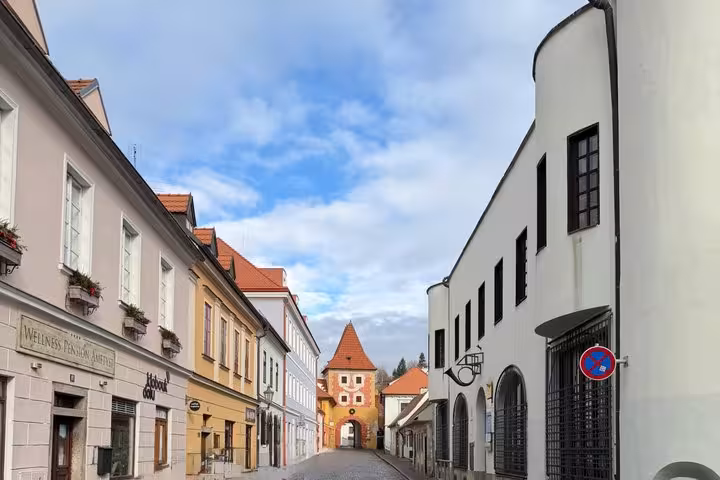 Cesky Krumlov old town street and medieval tower, scenic stop on Vienna to Prague private transfer