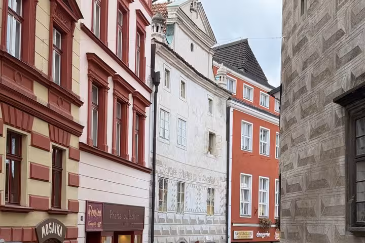 Colorful Cesky Krumlov old town facades on a charming street, stop on private day tour from Salzburg